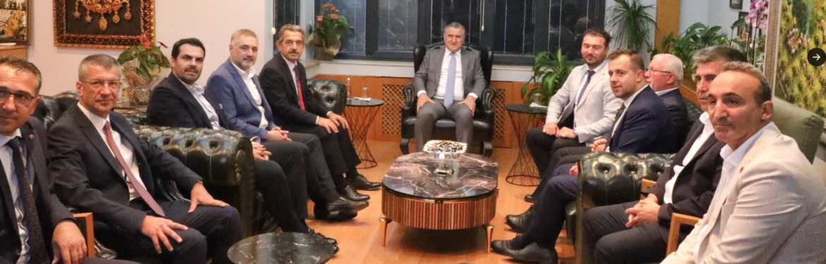 a group of men sitting in chairs